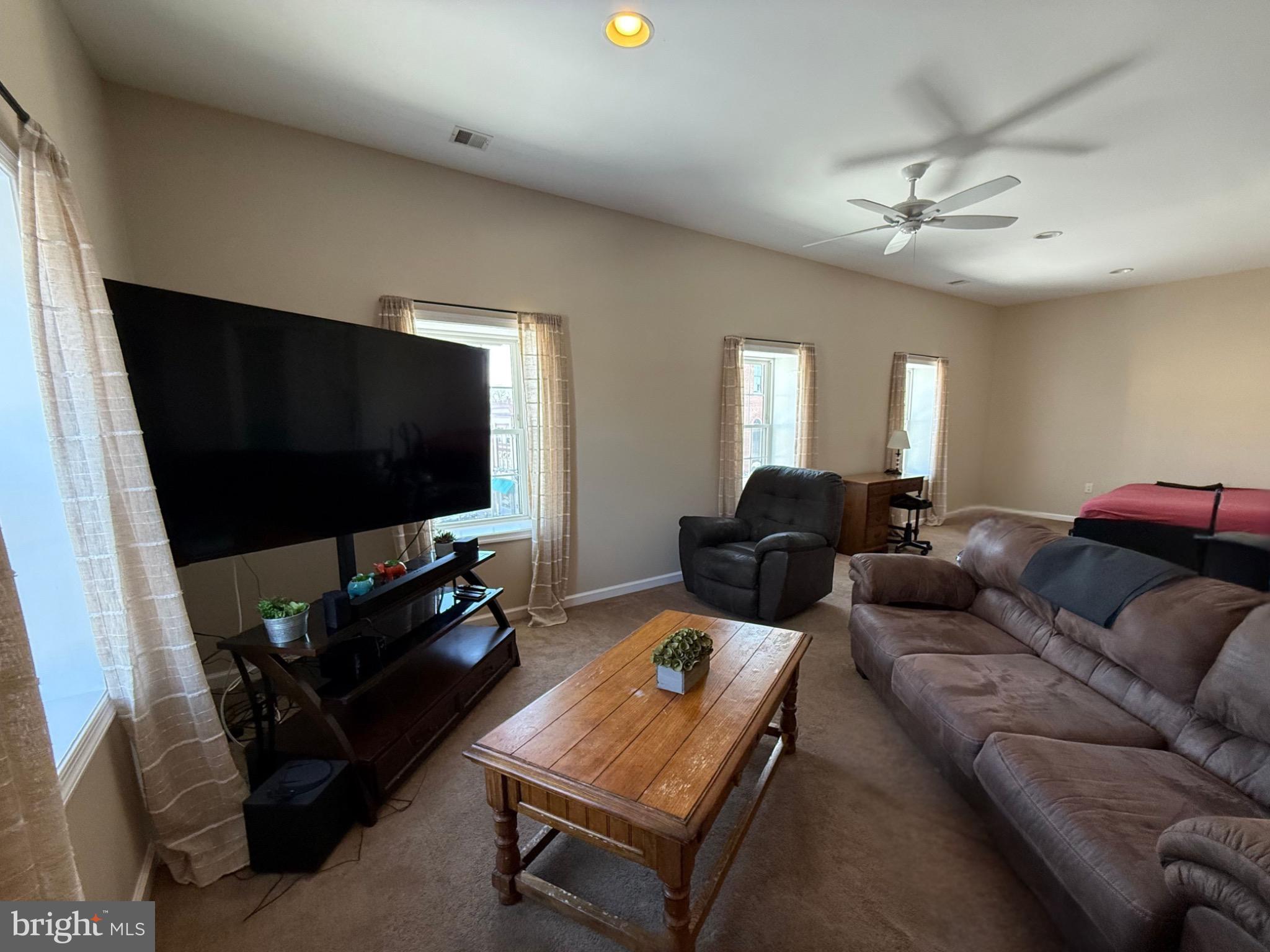 2 South 3rd Street, Unit 1 Oxford, PA 19363 - Photo 6 of 14 a living room with furniture and a flat screen tv