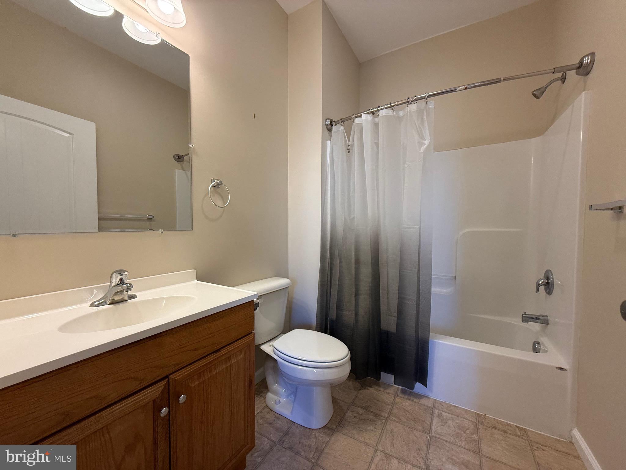 2 South 3rd Street, Unit 1 Oxford, PA 19363 - Photo 9 of 14 a bathroom with a sink toilet a mirror and shower