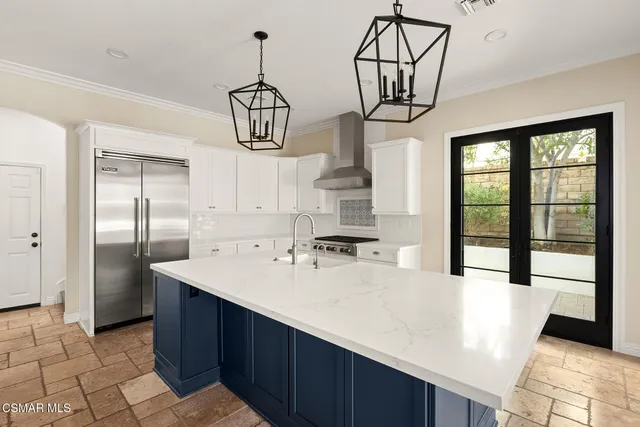 a living room with a couch flat screen tv and a large window