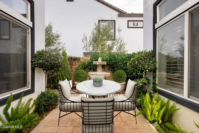 a view of a back yard with parking space