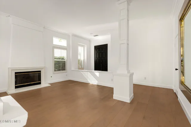 a view of kitchen with sink microwave and cabinets