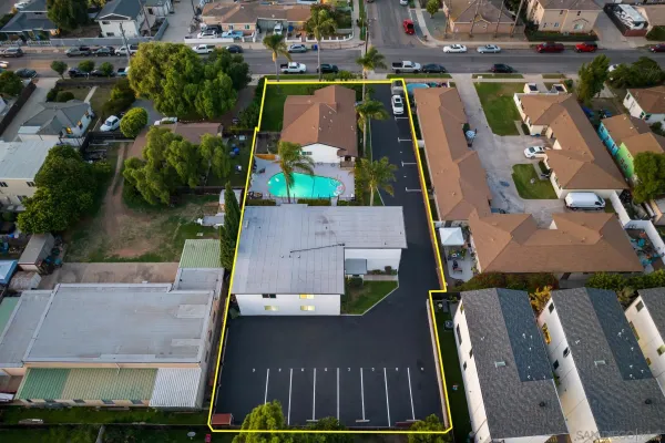 an aerial view of residential houses with outdoor space