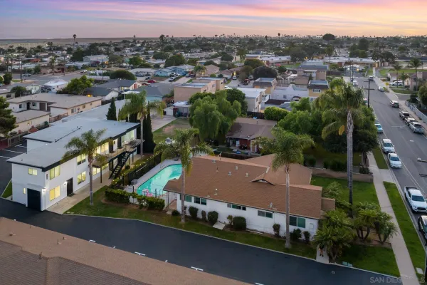 an aerial view of residential houses with outdoor space