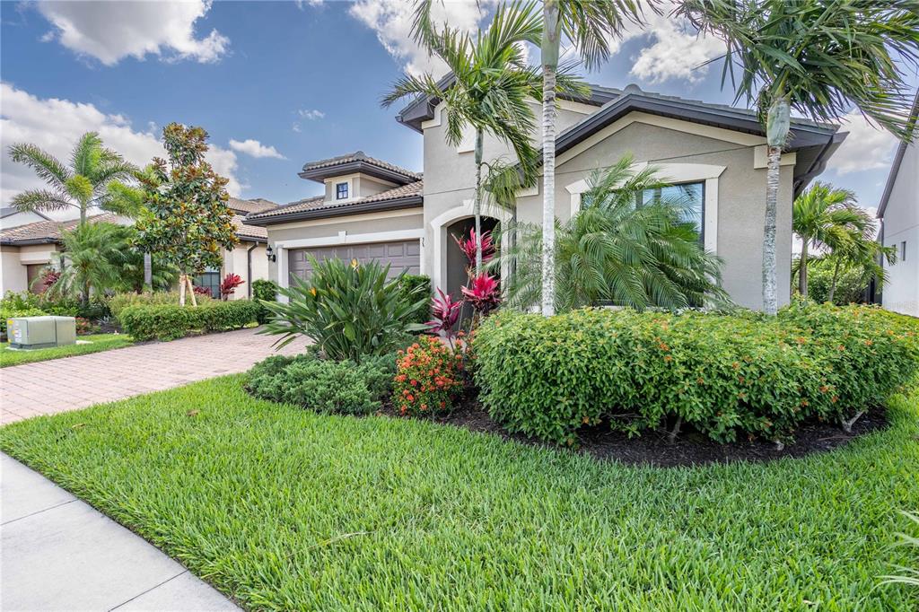 11106 Sandhill Preserve Drive Sarasota, FL 34238 - Photo 1 of 42 a front view of house with yard and green space
