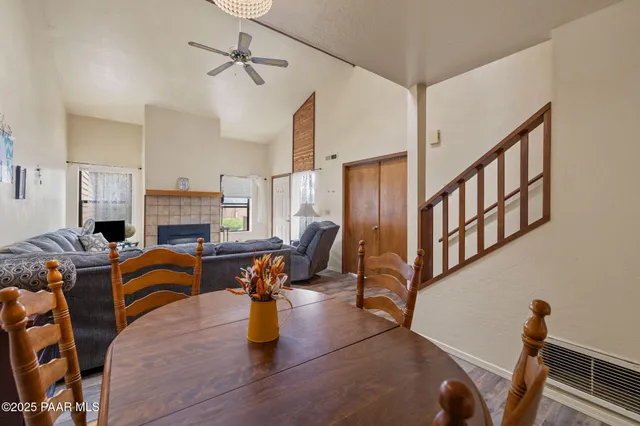 a living room with furniture fireplace and a window