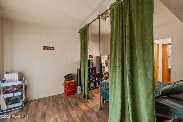 a view of an entryway with wooden floor