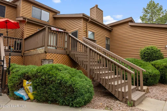 a view of a house with wooden stairs