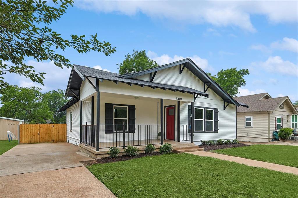 2410 Catherine Street Dallas, TX 75211 - Photo 1 of 1 front view of a house with a yard