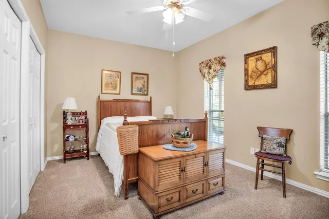 a bed room with furniture and a window