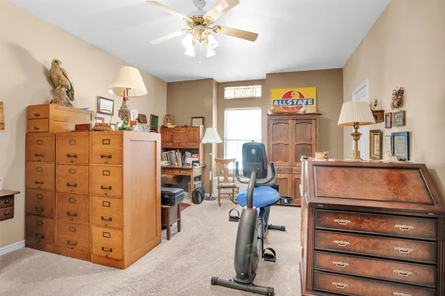 a view of hall way with furniture