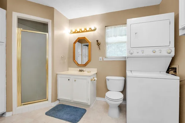a bathroom with a toilet a sink and a mirror