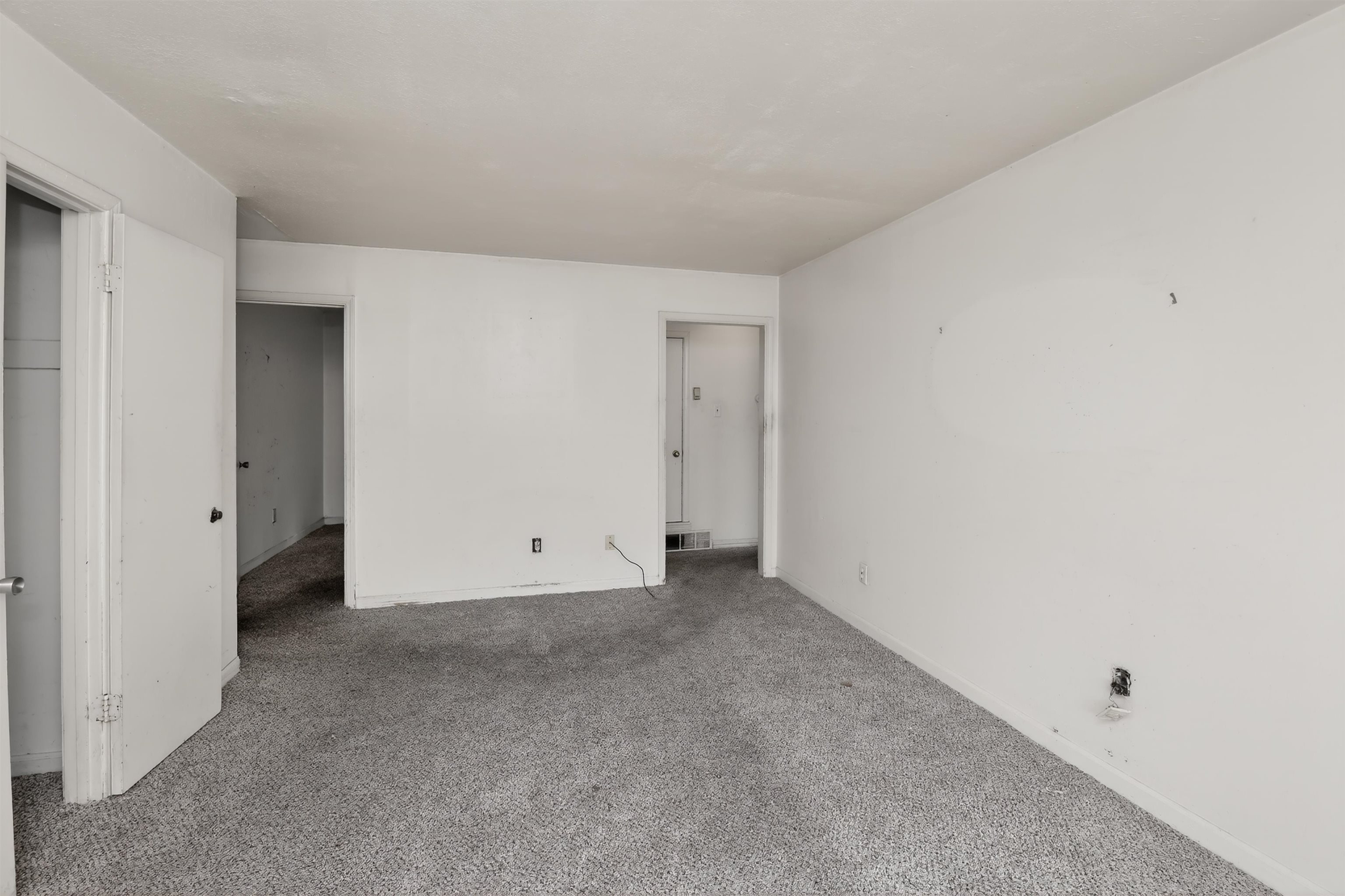 3451 Birdsong Ferry Road Memphis, TN 38118 - Photo 23 of 27 Carpeted room with white painted walls and multiple open doorways