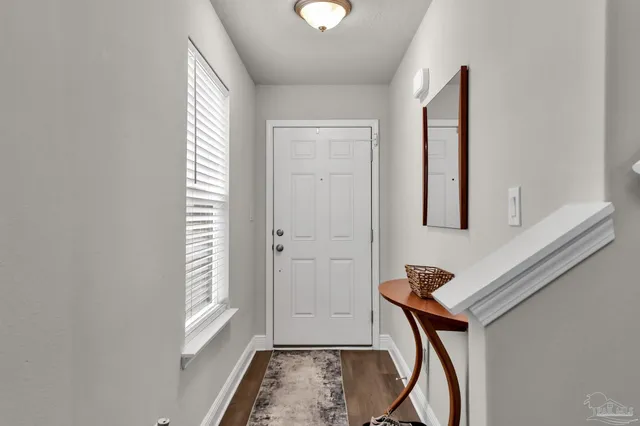a view of entryway with wooden floor