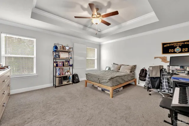 a living room with furniture gym equipment and a large window