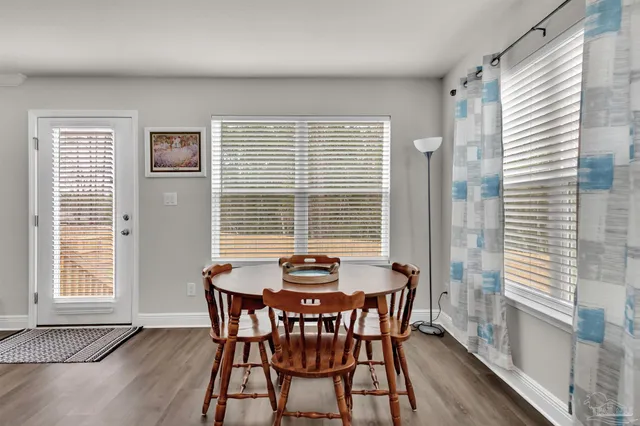 a dining room with furniture and window