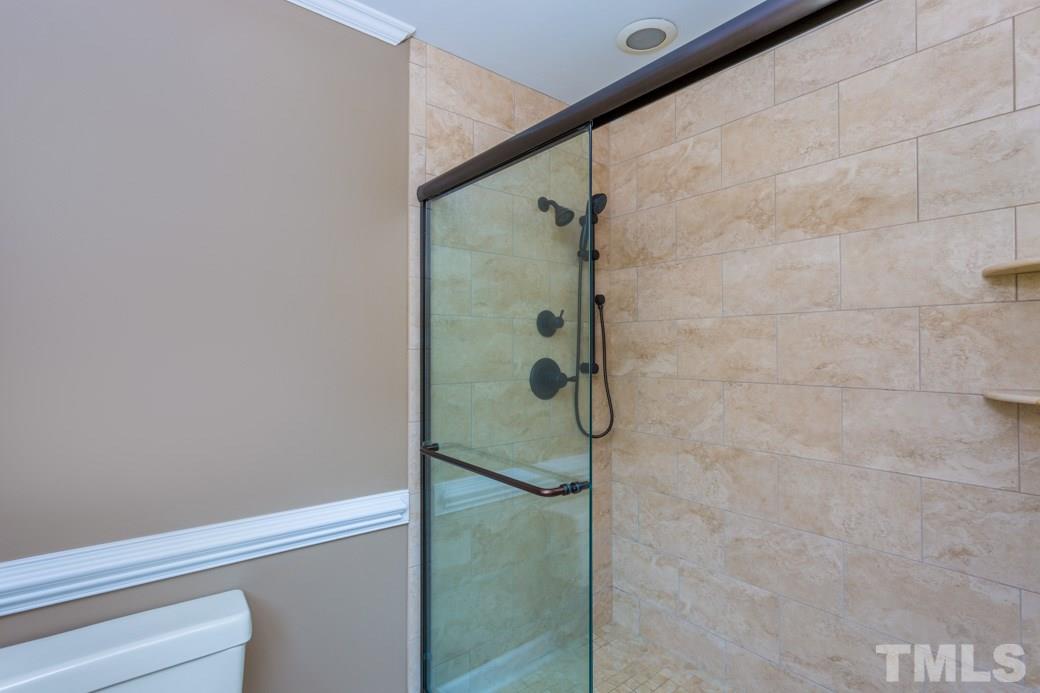 6409 Arnold Road Raleigh, NC 27607 - Photo 14 of 25 a bathroom with a shower