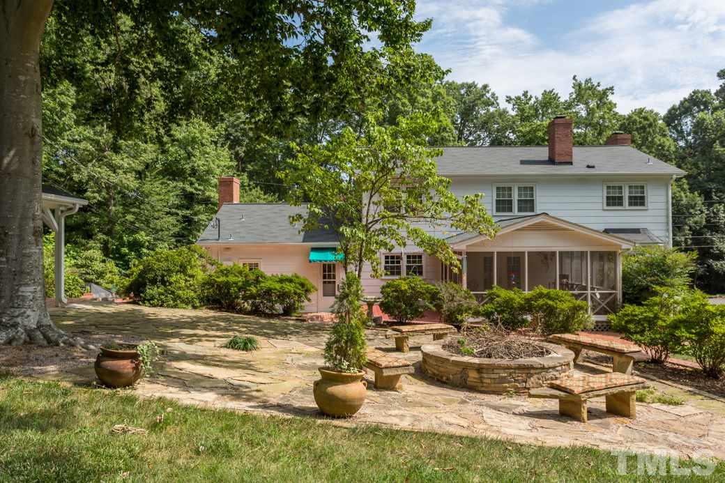 6409 Arnold Road Raleigh, NC 27607 - Photo 22 of 25 a view of a house with backyard sitting area and swimming pool