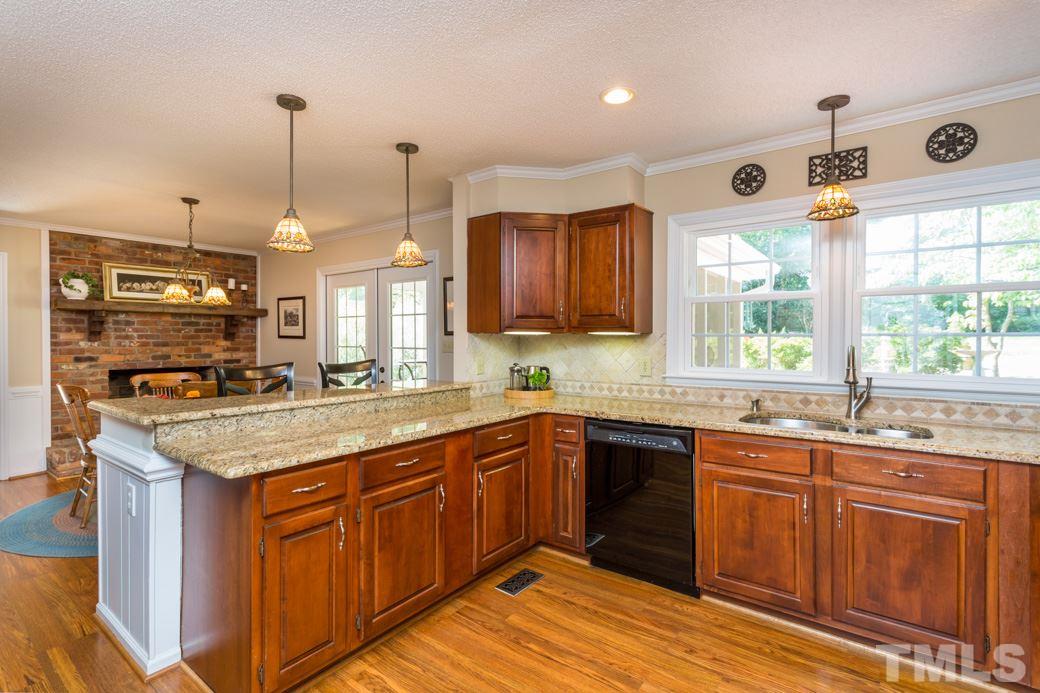 6409 Arnold Road Raleigh, NC 27607 - Photo 8 of 25 a kitchen with lots of counter space sink and appliances
