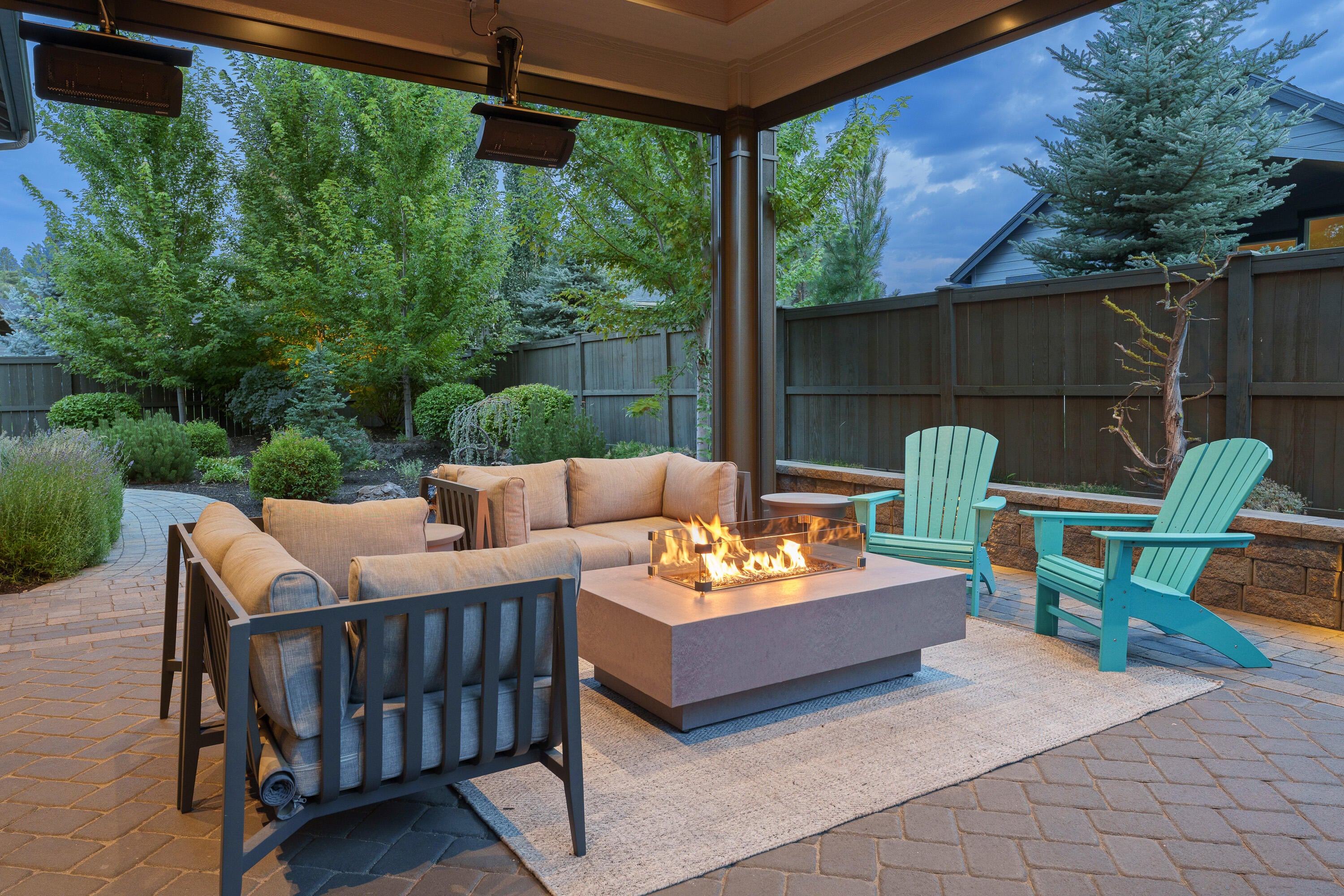 60869 Southwest Headwaters Loop Bend, OR 97702 - Photo 4 of 50 Four season outdoor living space with ceiling-mounted heaters and automated privacy screens