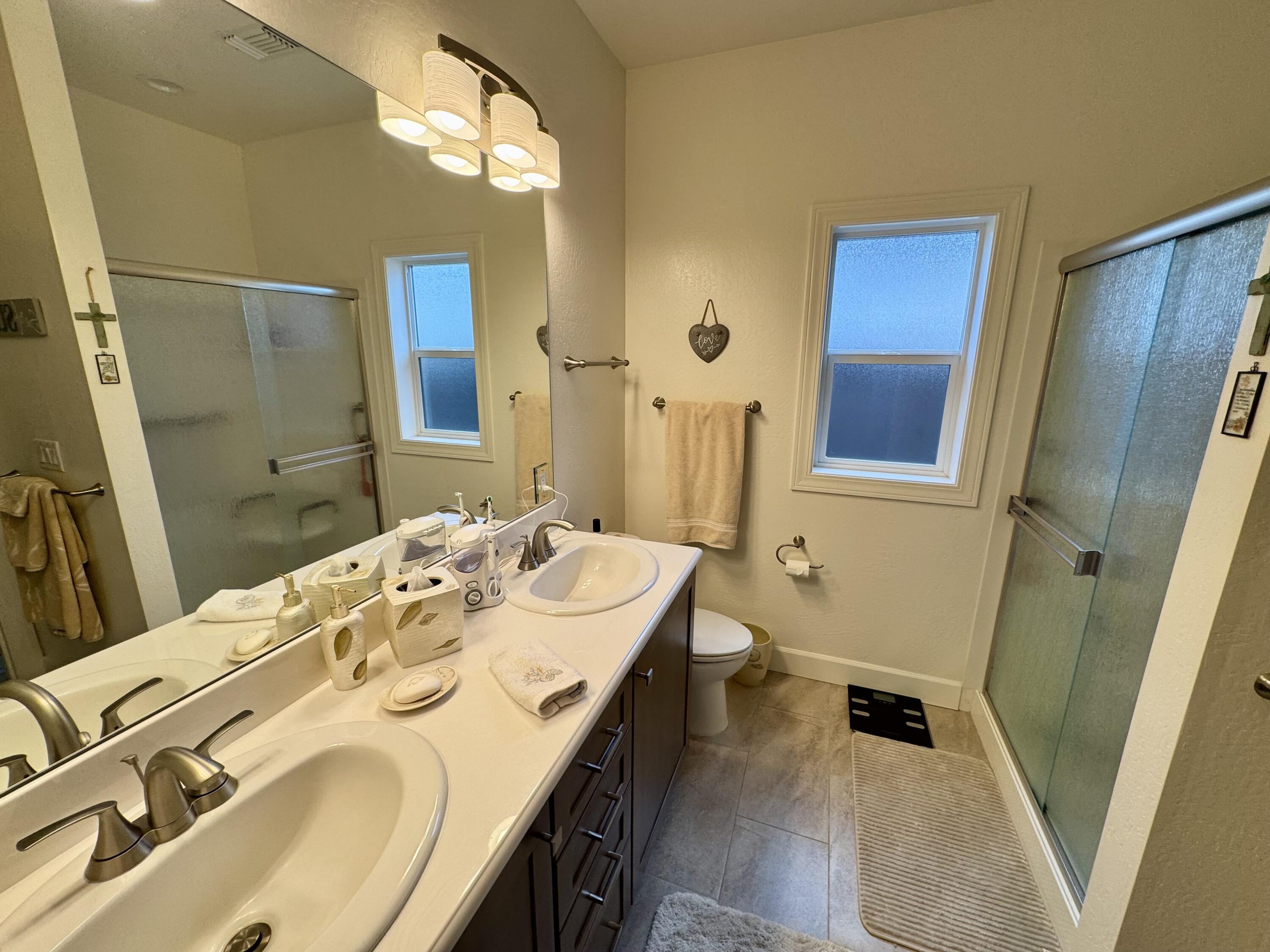 438 Cheney Loop Central Point, OR 97502 - Photo 10 of 15 Primary bathroom; dual sinks, large shower, walk-in closet