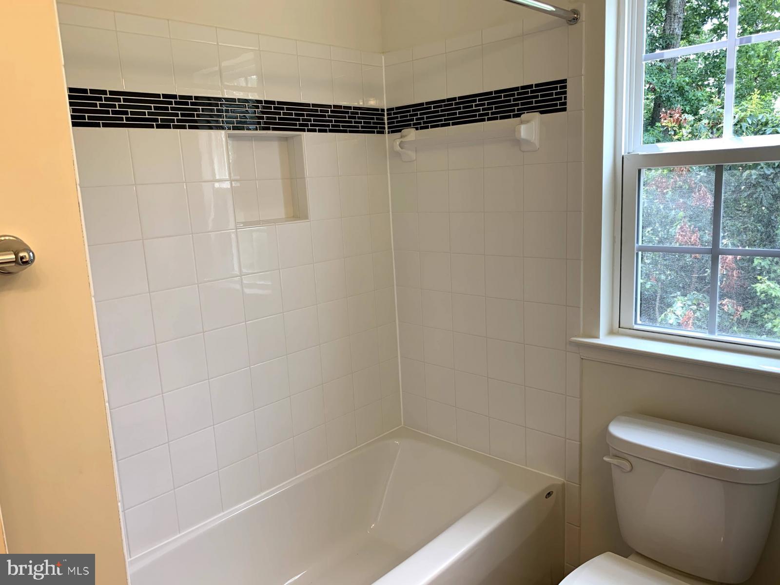 263 Trails Way Joppa, MD 21085 - Photo 11 of 27 a bathroom with a shower and a bathtub