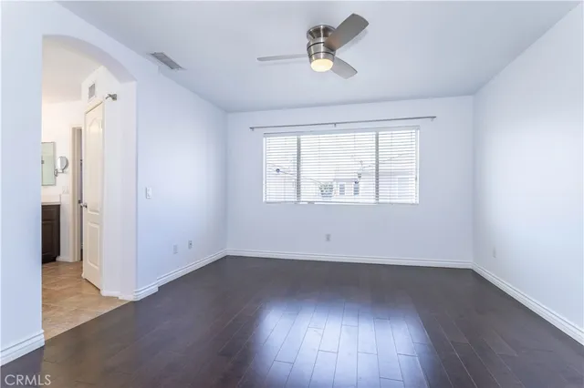 a spacious bathroom with a tub sink and mirror