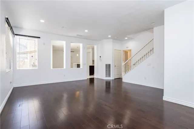 a kitchen with stainless steel appliances kitchen island granite countertop a large counter top and a stove top oven