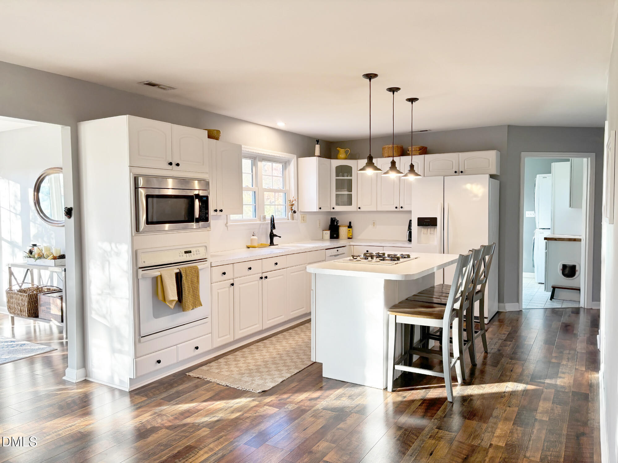 2109 Harris Road Rougemont, NC 27572 - Photo 11 of 35 a kitchen with stainless steel appliances a stove a sink cabinets and wooden floor