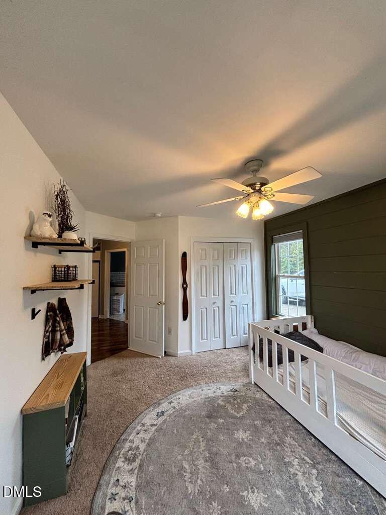 2109 Harris Road Rougemont, NC 27572 - Photo 19 of 35 a spacious bedroom with a bed and a walk in closet