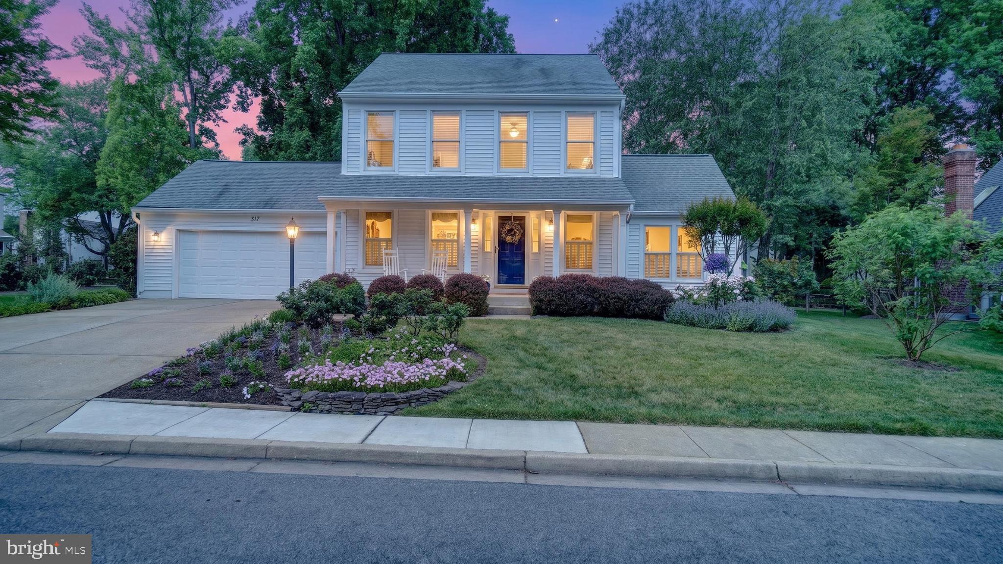 317 Canterfield Road Annapolis, MD 21403 - Photo 66 of 66 a front view of a house with a garden