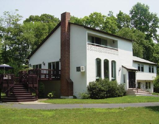 16 North Pasture Road Westport, CT 06880 - Photo 1 of 1 a front view of a house with a yard