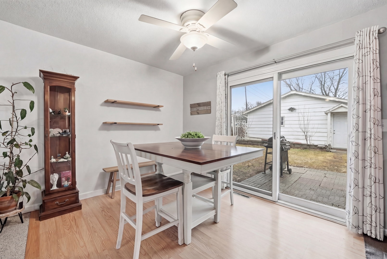 200 Ramona Avenue Rochelle, IL 61068 - Photo 8 of 21 a view of a dining room with furniture and a chandelier