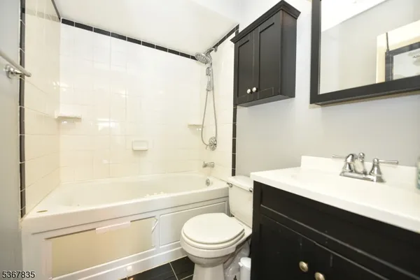 a bathroom with a sink a toilet and a bathtub