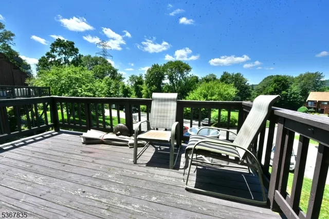 a view of a patio with wooden floor