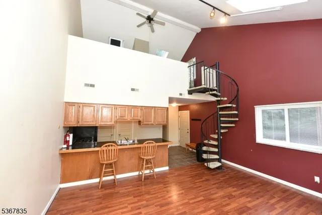 a view of kitchen and wooden floor