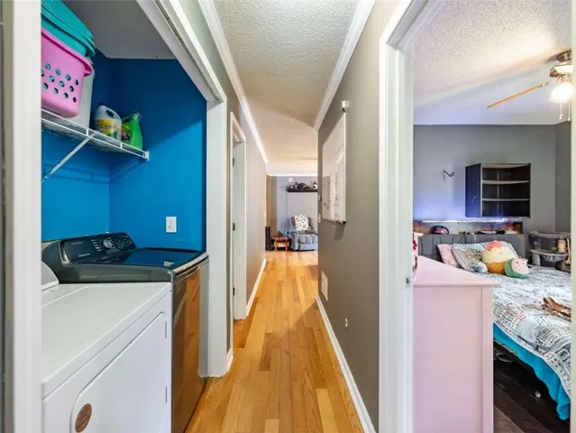 a view of hallway with washer and dryer