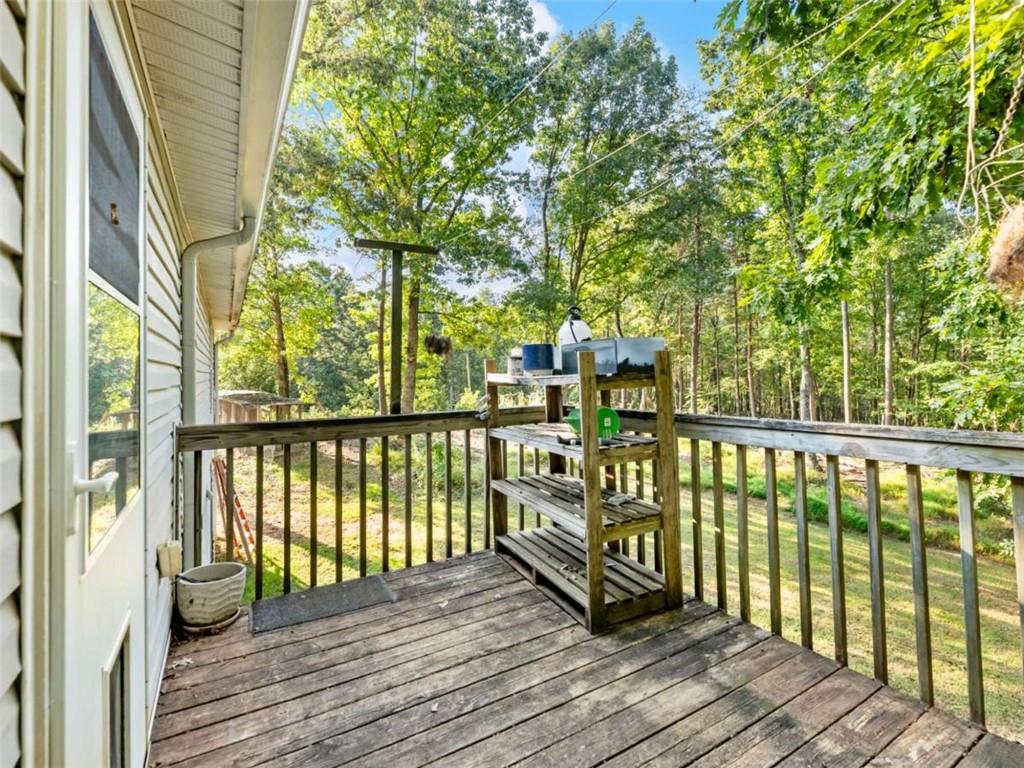310 Georgian Terrace Alto, GA 30510 - Photo 27 of 39 a view of balcony with wooden floor and fence