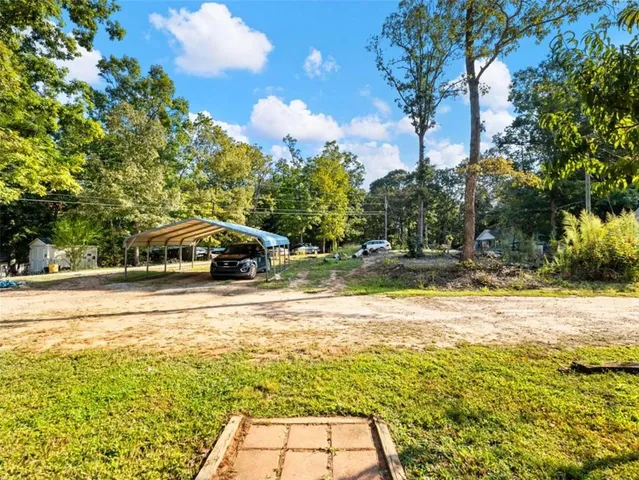 a yellow house with swimming pool in front of it