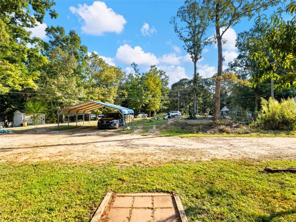 310 Georgian Terrace Alto, GA 30510 - Photo 38 of 39 a yellow house with swimming pool in front of it