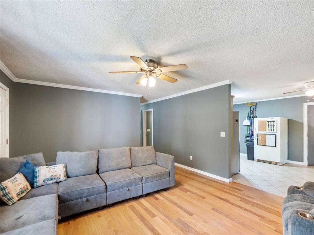 310 Georgian Terrace Alto, GA 30510 - Photo 5 of 39 a living room with furniture and a ceiling fan