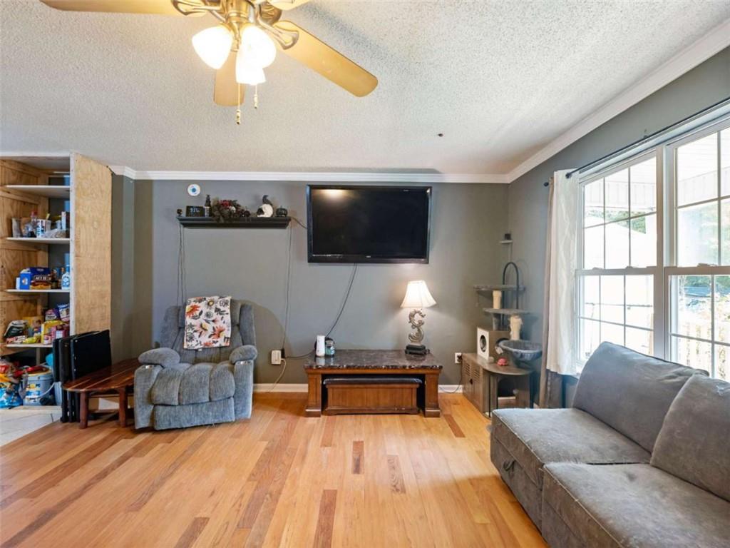 310 Georgian Terrace Alto, GA 30510 - Photo 6 of 39 a living room with furniture and a flat screen tv