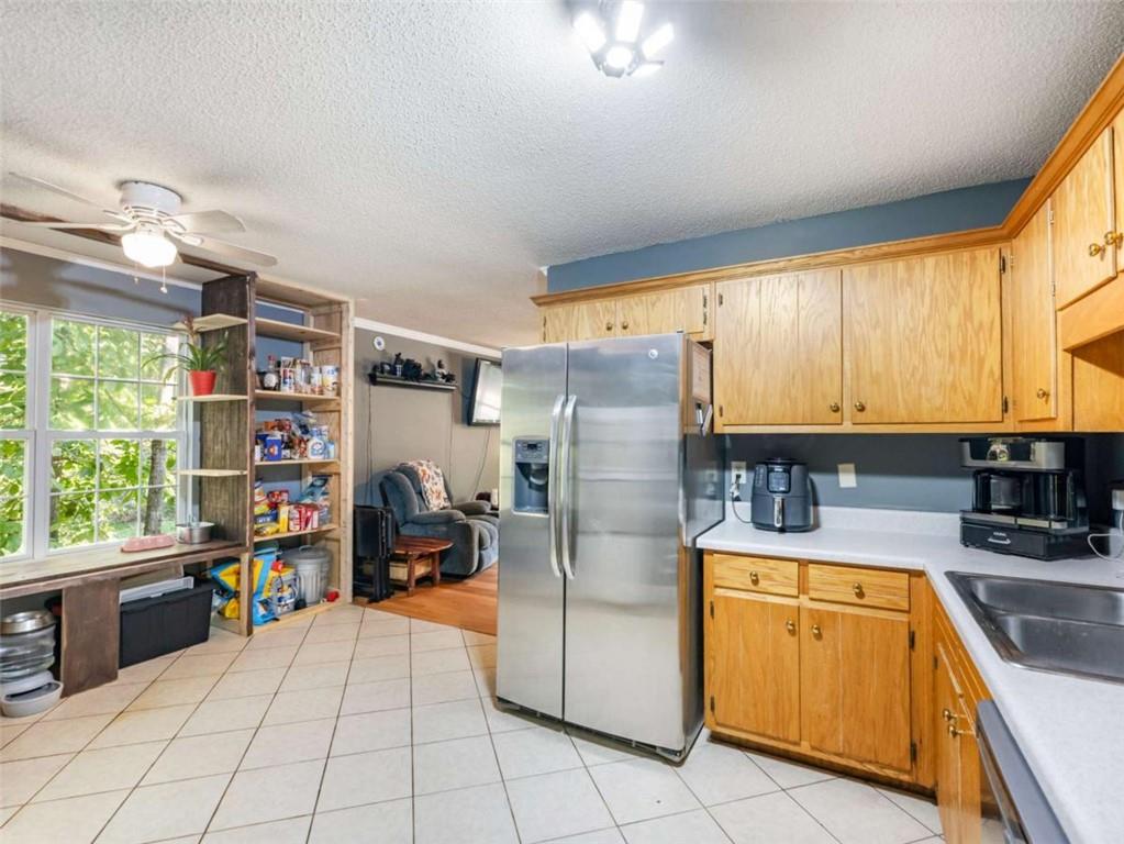 310 Georgian Terrace Alto, GA 30510 - Photo 8 of 39 a kitchen with refrigerator and window