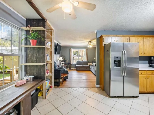 a kitchen with refrigerator and window