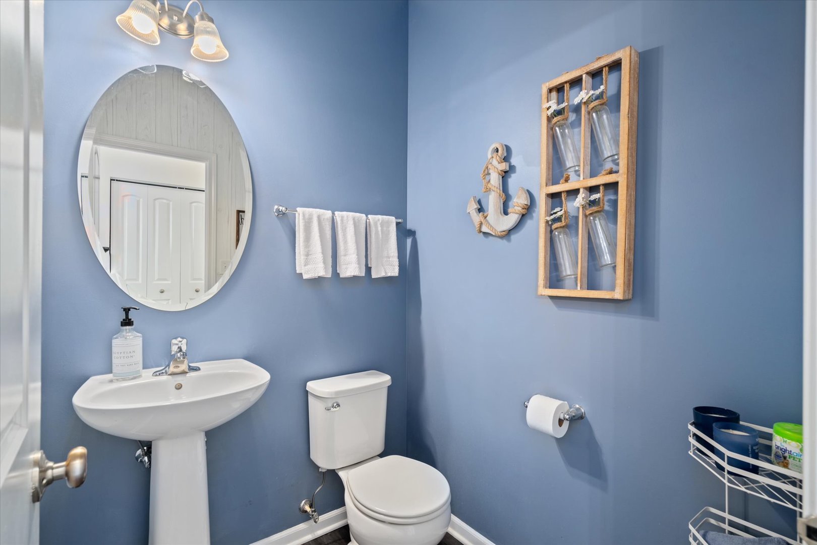 435 Fawn Lane Oswego, IL 60543 - Photo 12 of 26 a bathroom with a toilet sink and mirror