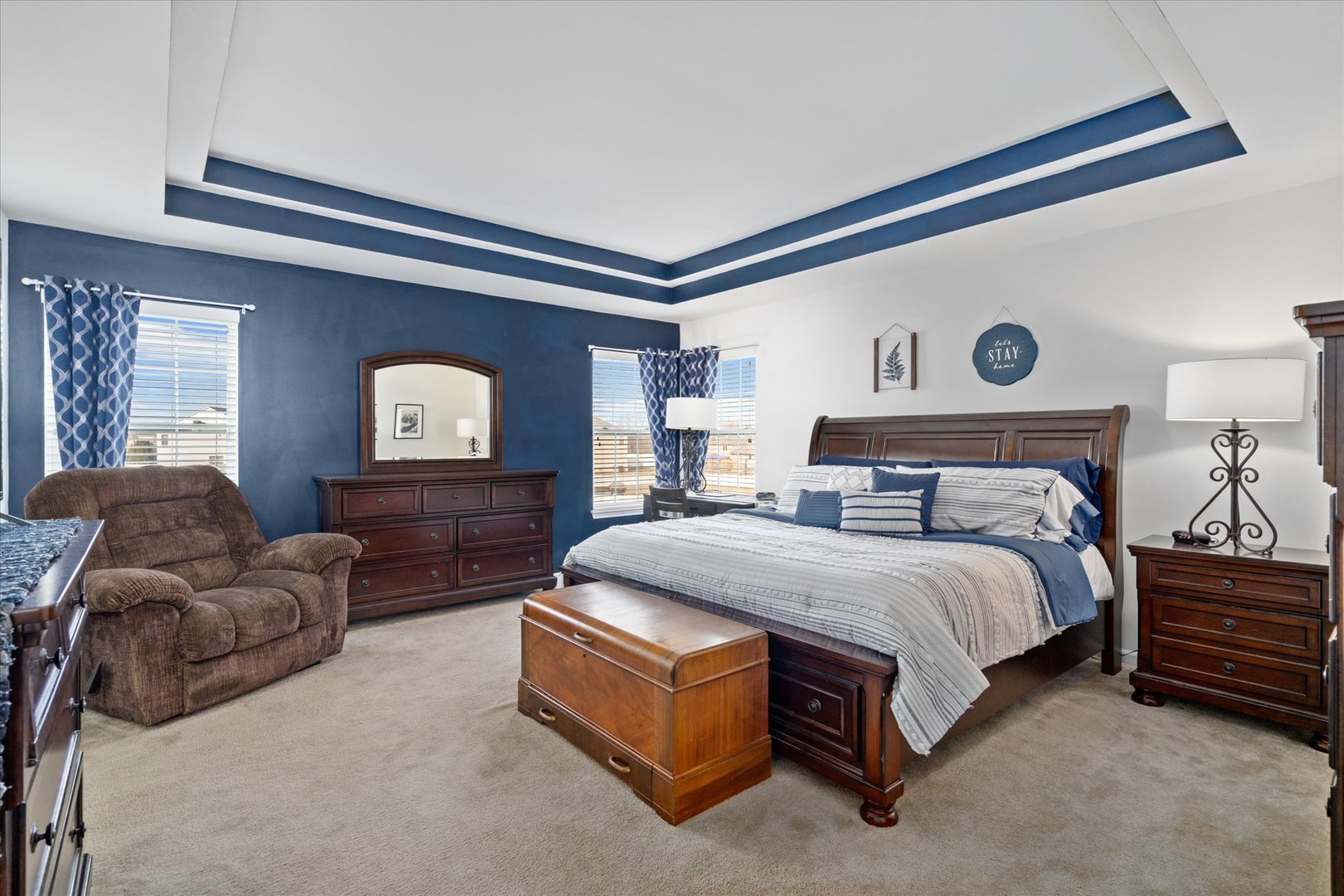 435 Fawn Lane Oswego, IL 60543 - Photo 13 of 26 a spacious bedroom with a bed and a mirror on dresser