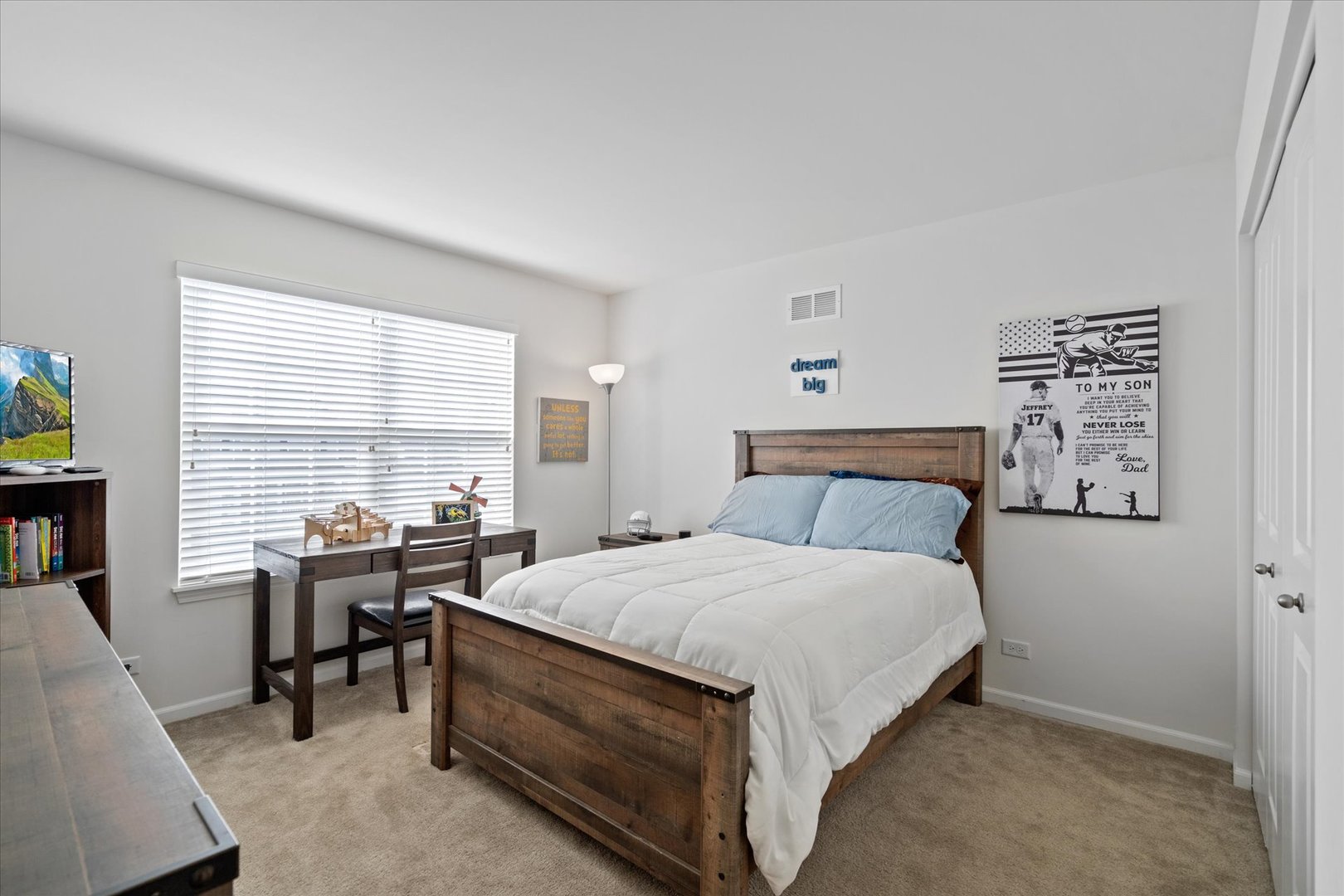 435 Fawn Lane Oswego, IL 60543 - Photo 18 of 26 a bedroom with a bed and a table in it