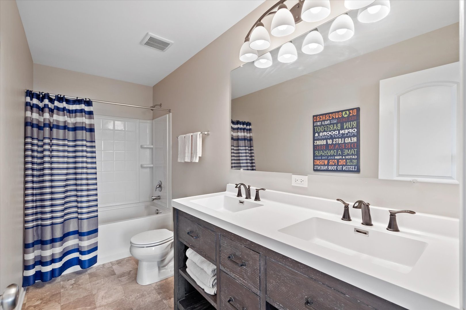 435 Fawn Lane Oswego, IL 60543 - Photo 20 of 26 a bathroom with a sink a toilet and shower