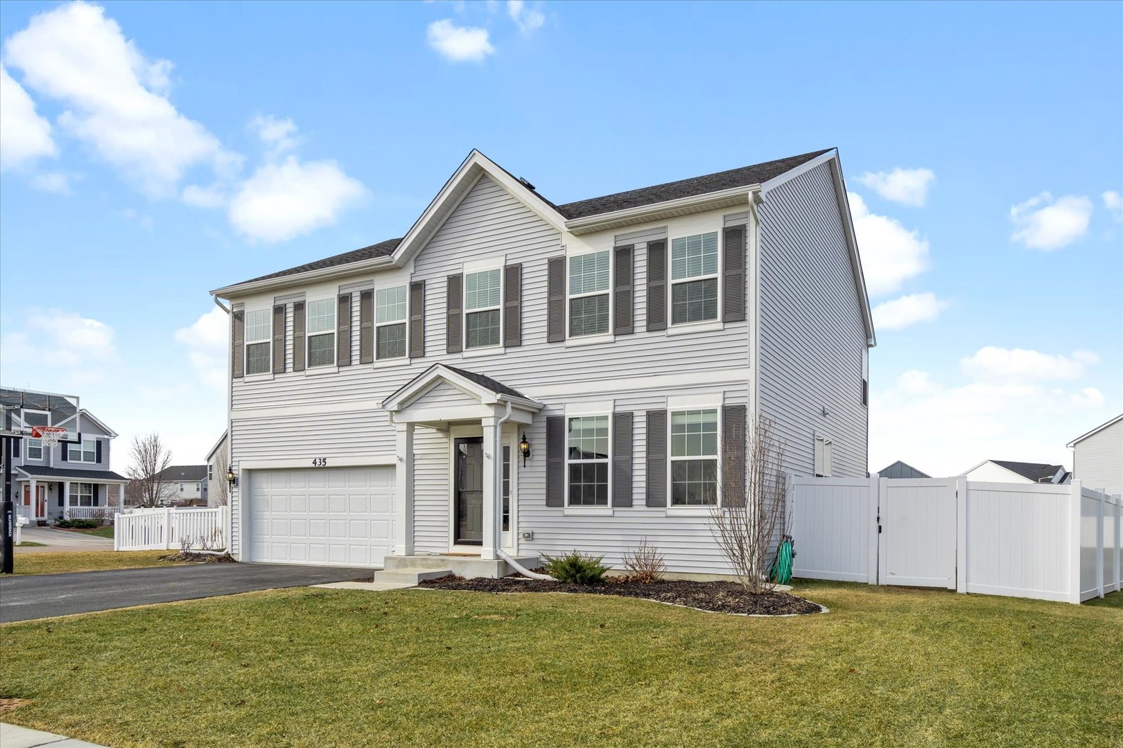 435 Fawn Lane Oswego, IL 60543 - Photo 2 of 26 a front view of a house with a yard