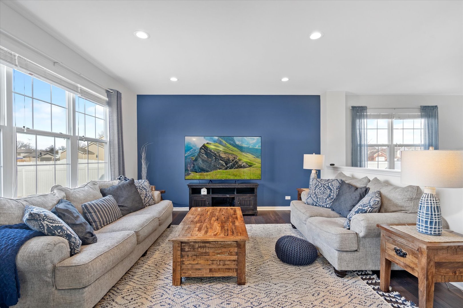 435 Fawn Lane Oswego, IL 60543 - Photo 9 of 26 a living room with furniture a rug and a flat screen tv