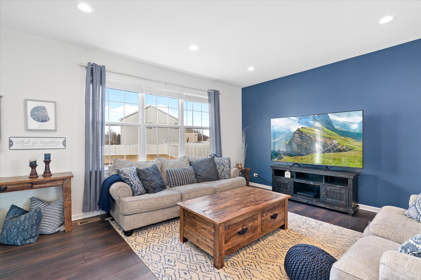 435 Fawn Lane Oswego, IL 60543 - Photo 10 of 26 a living room with furniture and a flat screen tv